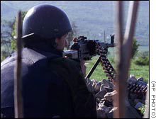 Utanian soldier fires on invader's positions